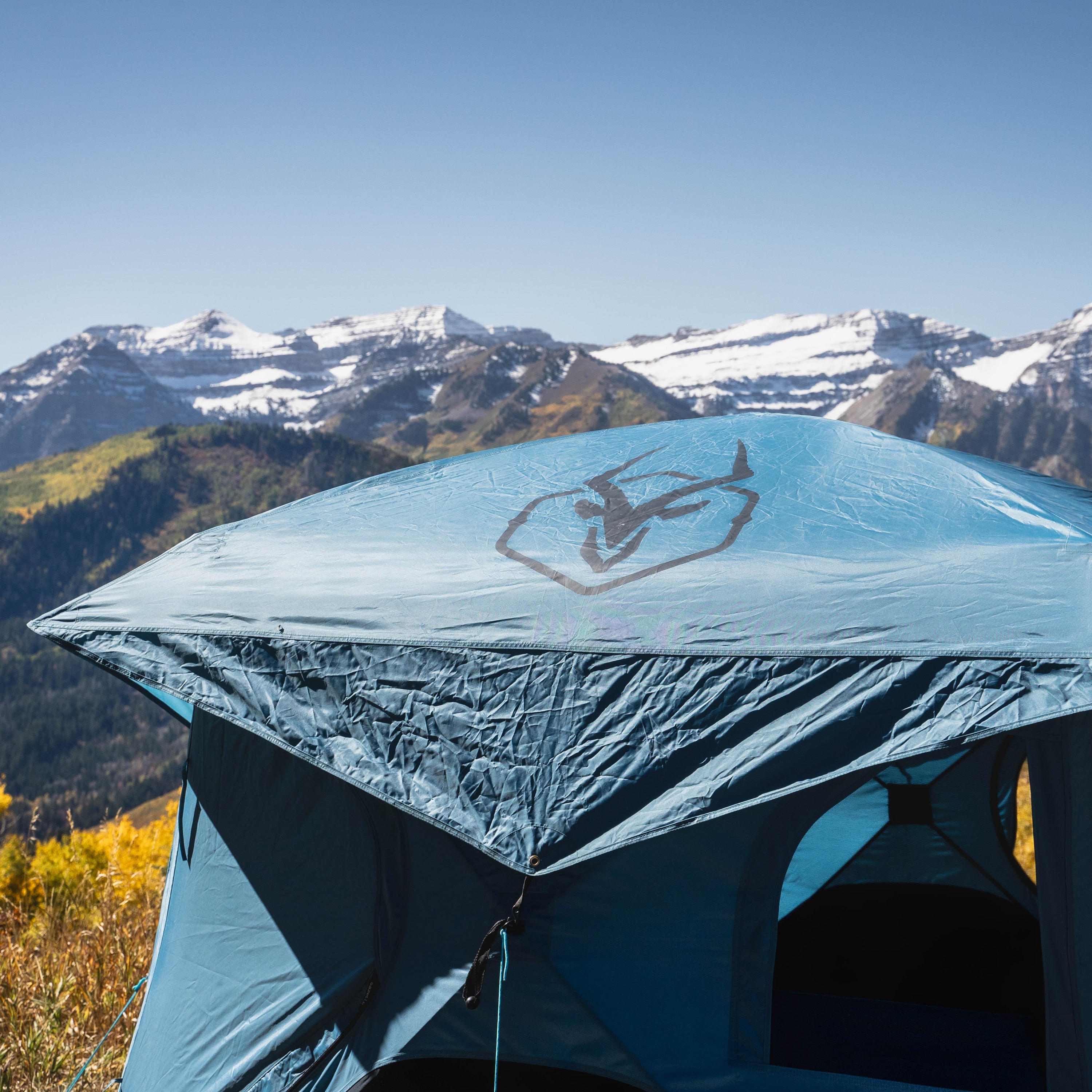 Oversized duffle bag with tent packed inside
