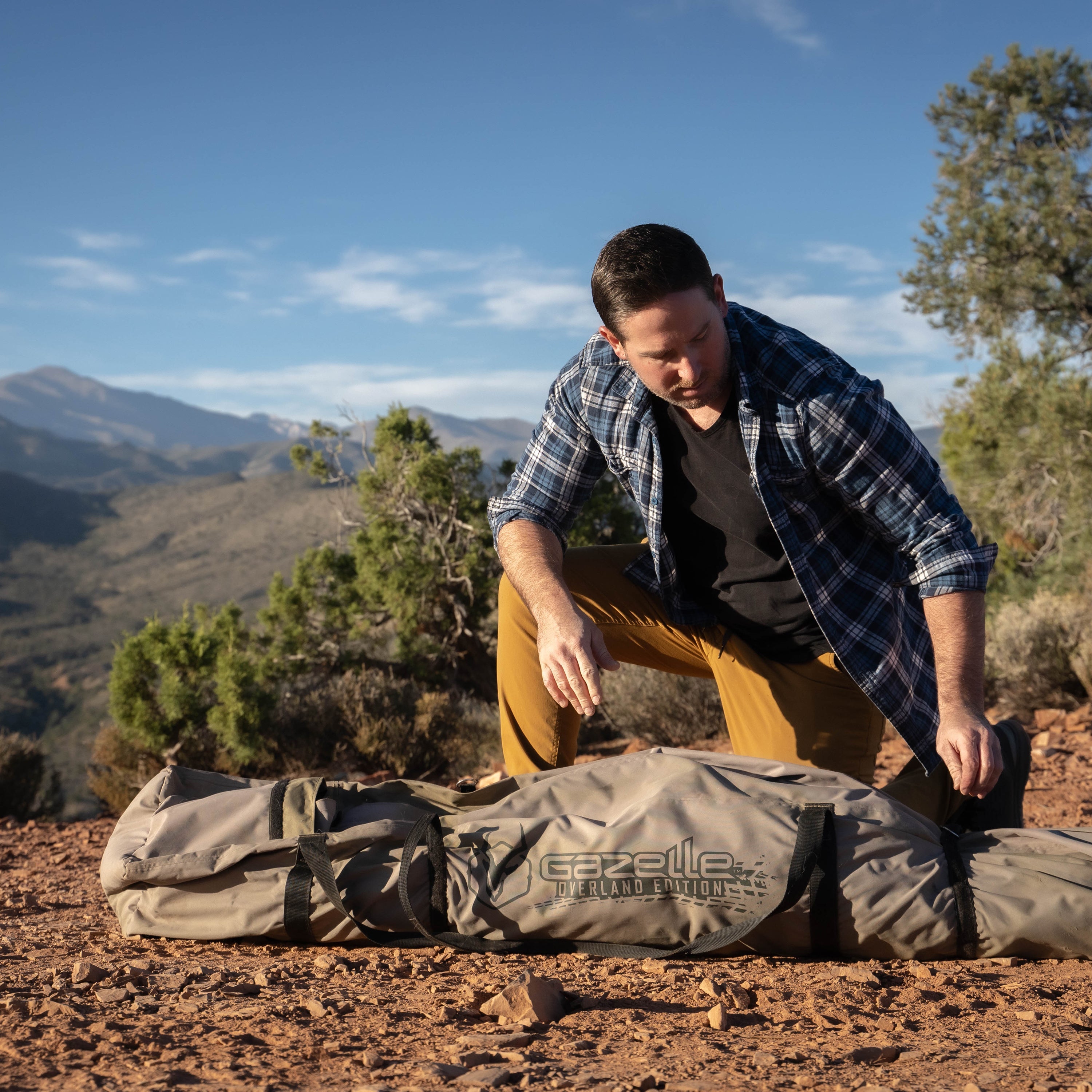Gazelle T4 Hub Tent Overland Edition with rain fly attached for weather protection.