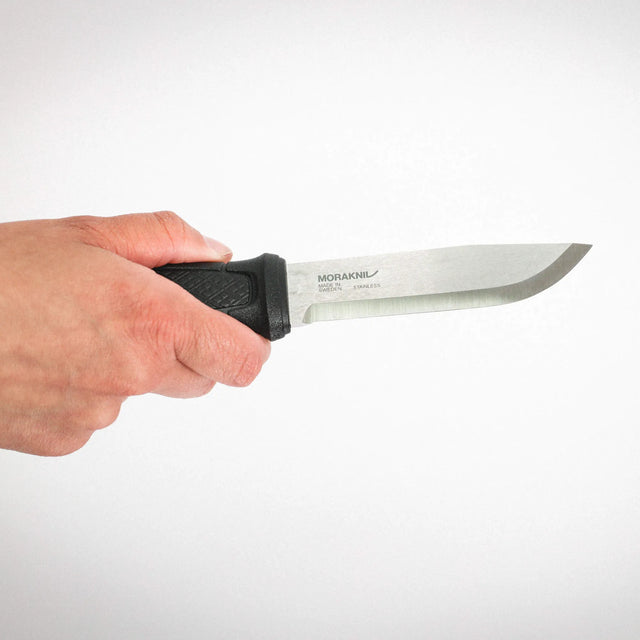 Hand holding a knife with a white background