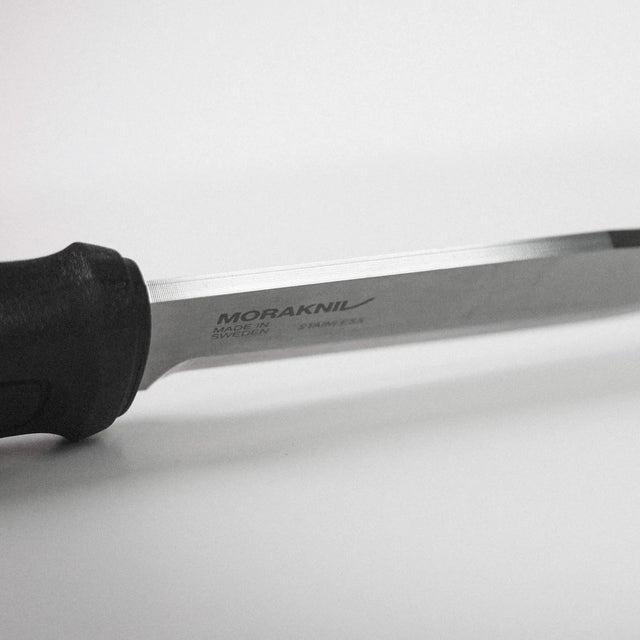 Knife with a black handle on a white background