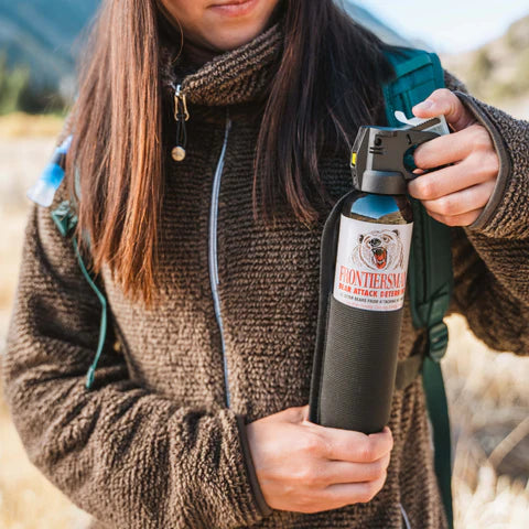 Quick-access bear spray holster design with no Velcro for silent deployment