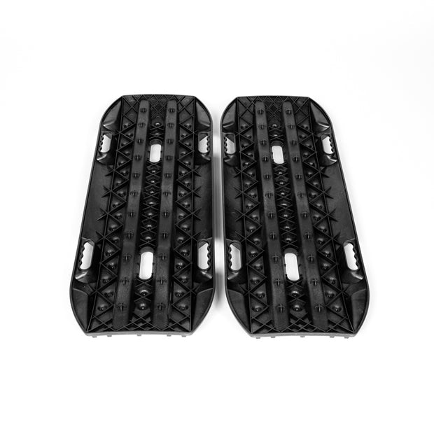 Fiberglass-reinforced RototraX recovery boards with X-shaped traction lugs for mud and sand recovery