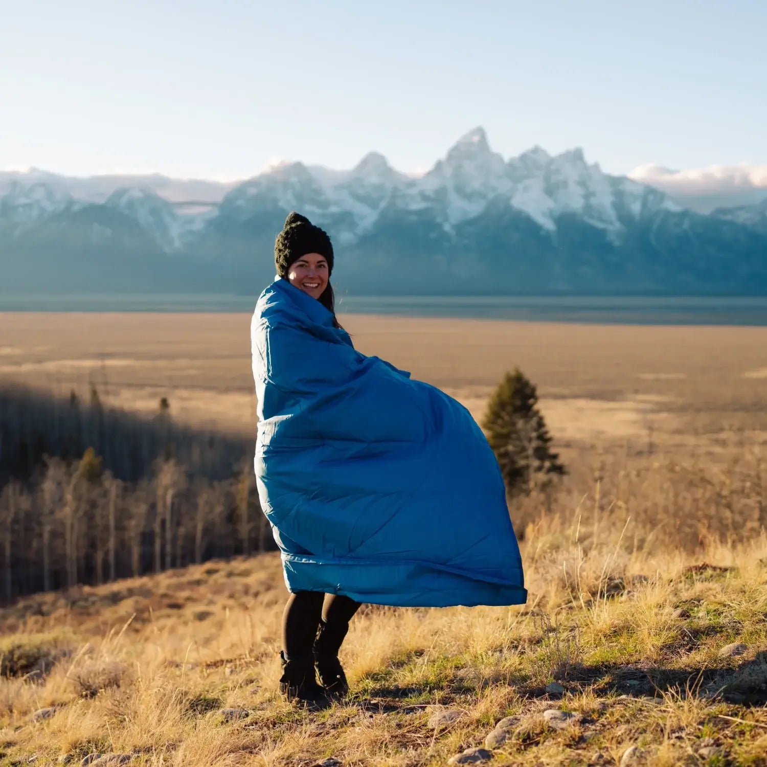 Portable Horizon blanket packed tightly in compression travel sack