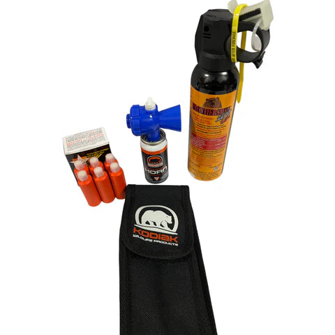 Complete Bear Necessities Kit showing holster, bear spray, horn, pen launcher, and flares