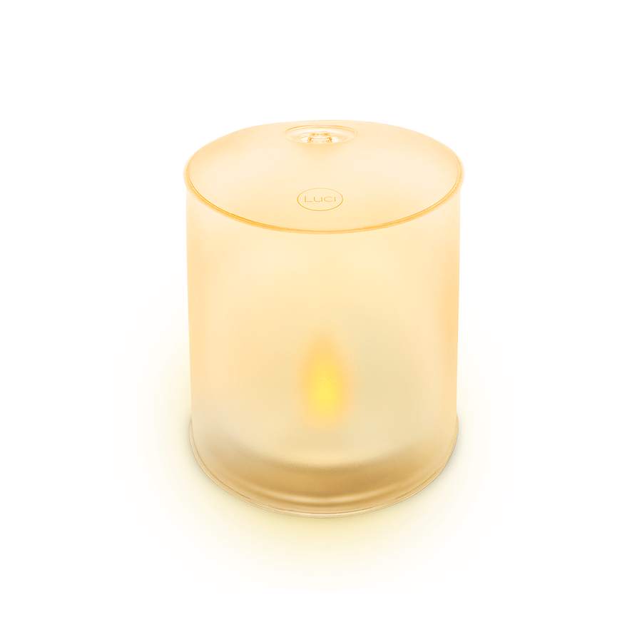 Smart candle with a warm glow on a white background