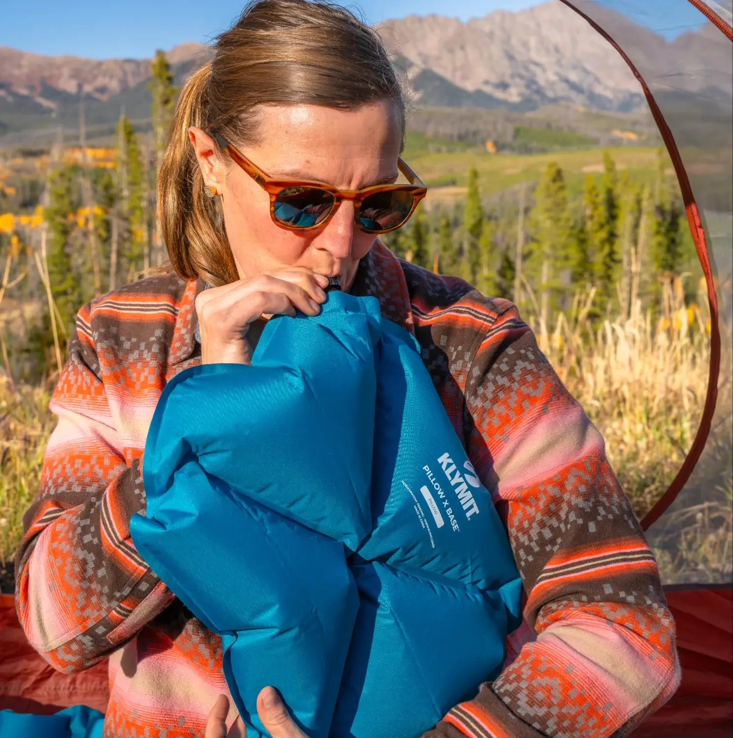 Lightweight inflatable pillow with rugged abrasion-resistant fabric