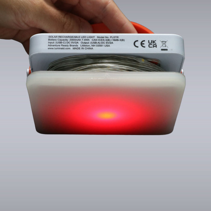 Solar-powered string lights illuminating tent campsite