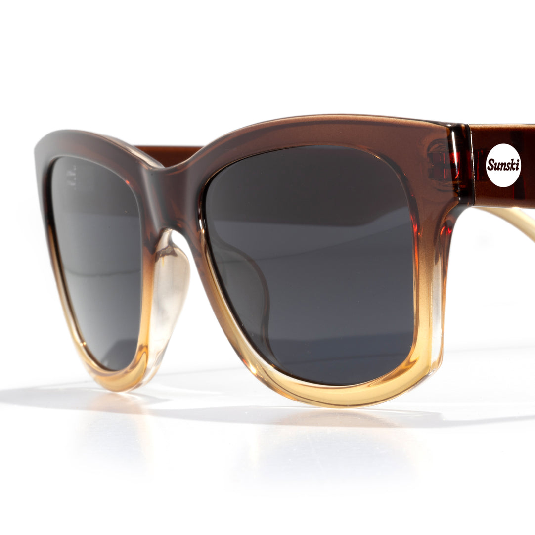 Classic medium frame polarized sunglasses with low wrap design

