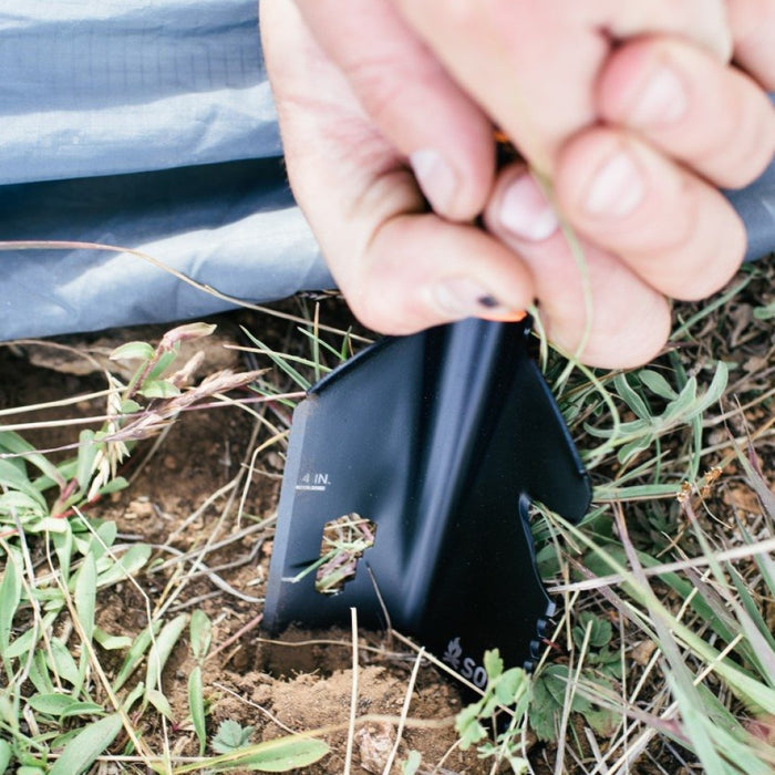 Stoke Shovel with Stow-It handle storing flint striker and Tinder Quik fire starters