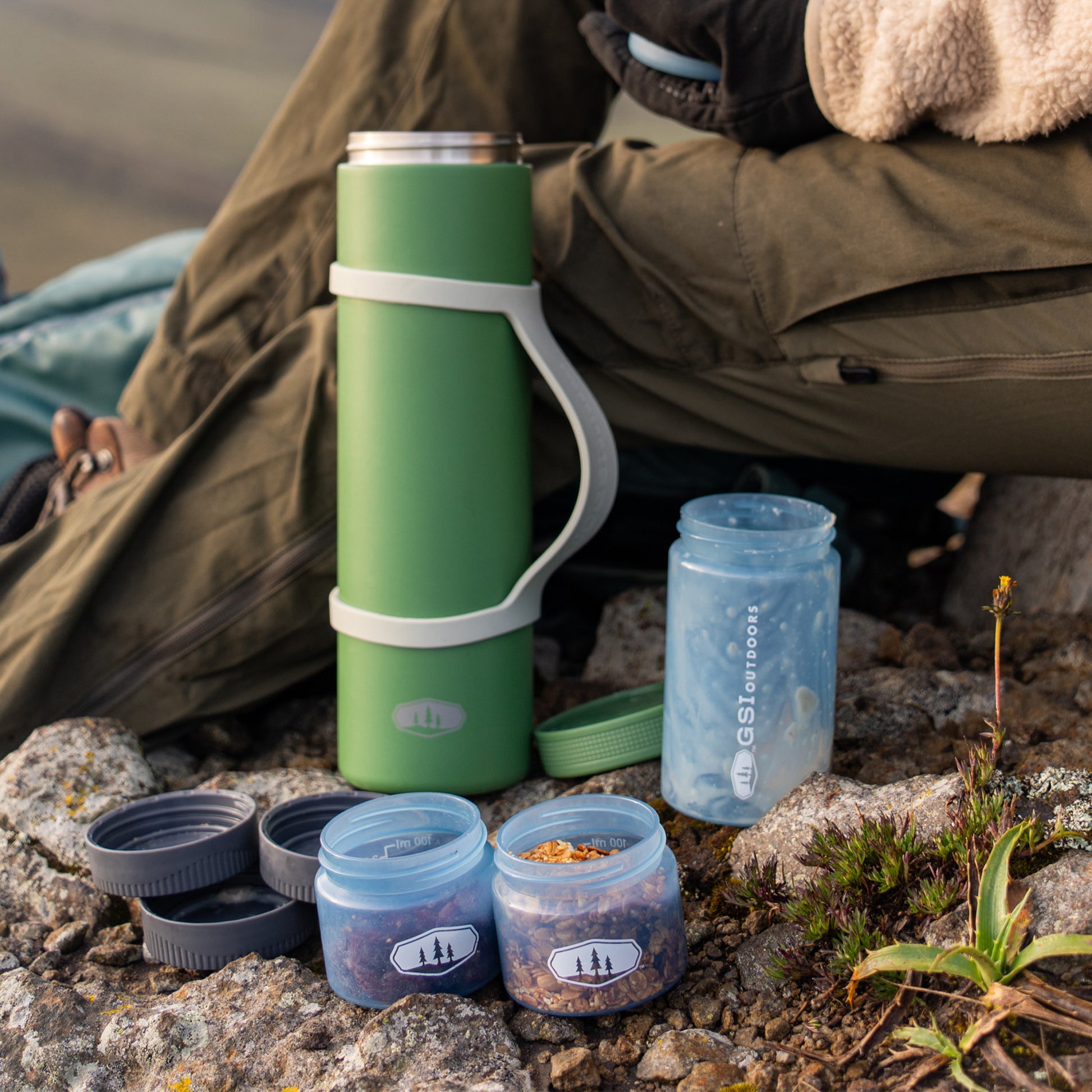 Vacuum insulated food container with removable stackable storage compartments.
