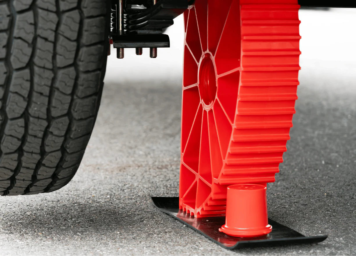 Rapid Jack leveling single axle RV at campsite