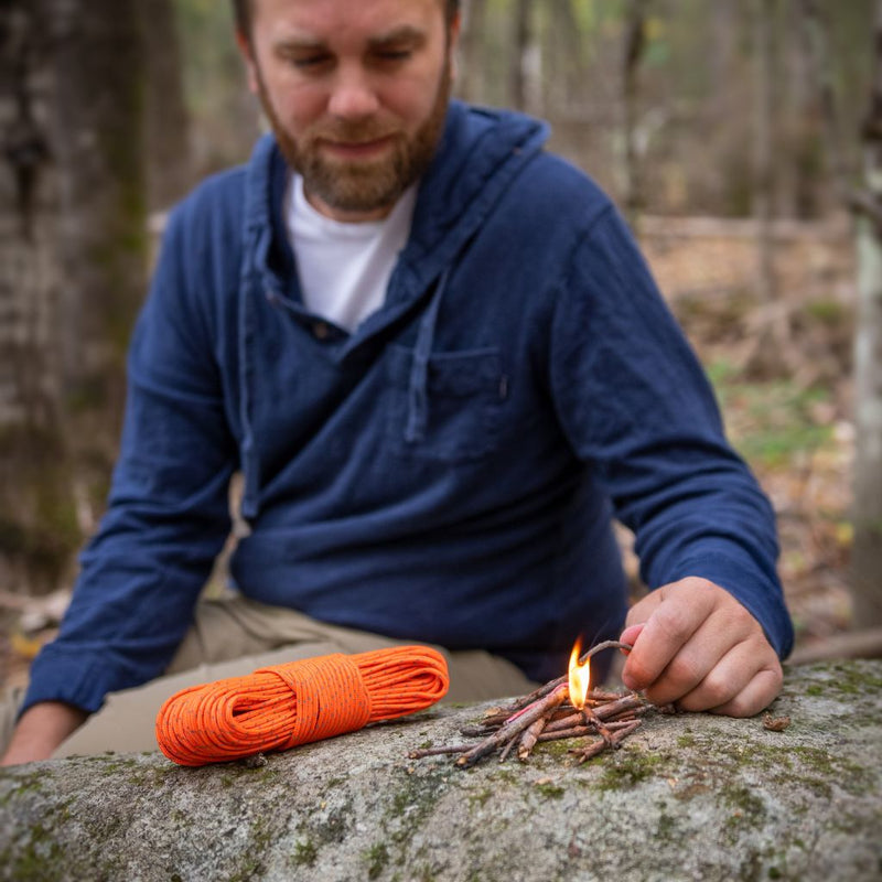 Bright reflective orange Utility Reflective Tinder Cord designed for high visibility, ideal for gear identification and rescue situations.