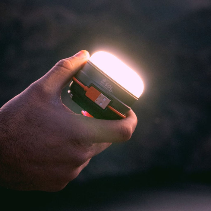 Rechargeable camping light with integrated USB charging cord

