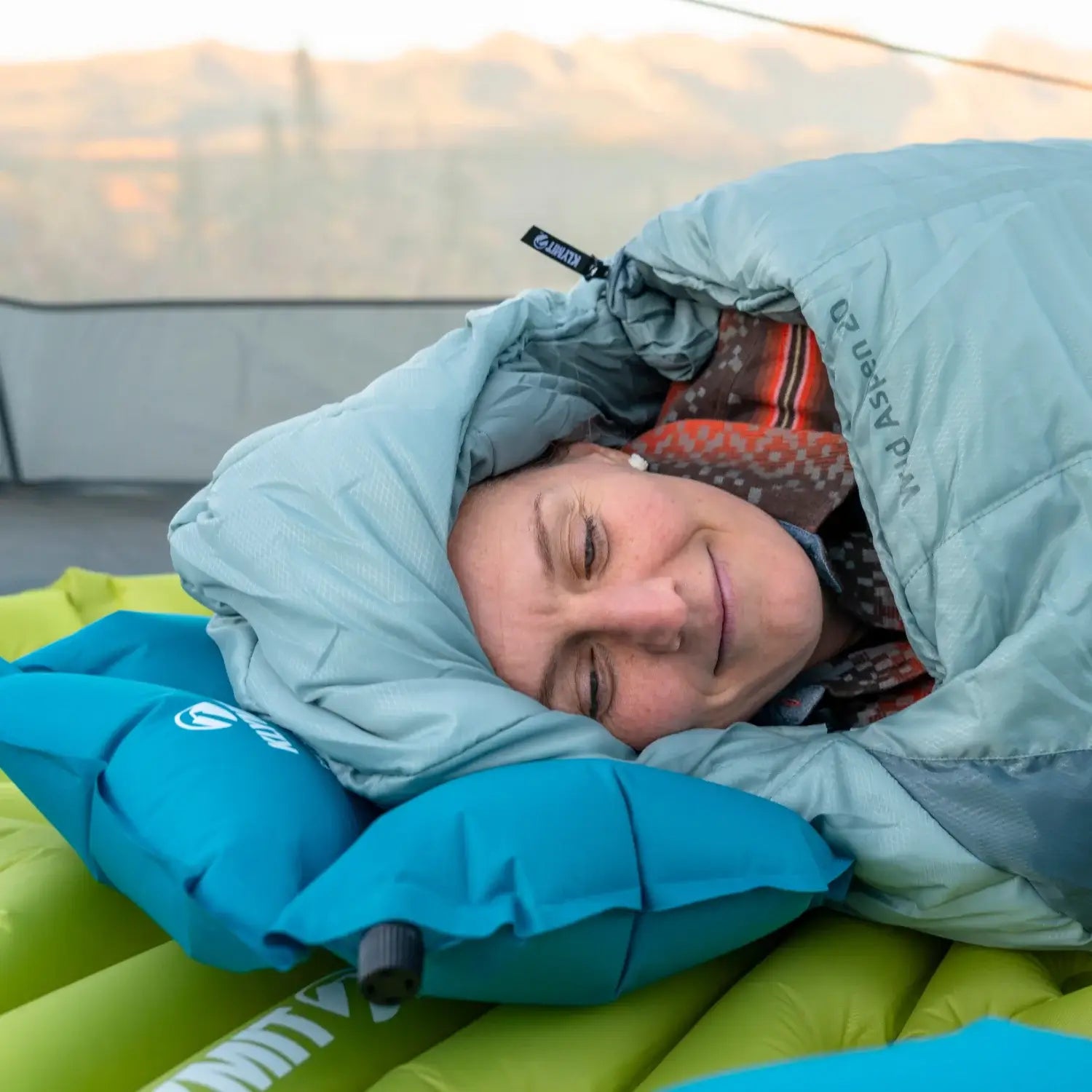 Pillow X Base inflatable pillow used inside a camping sleeping bag