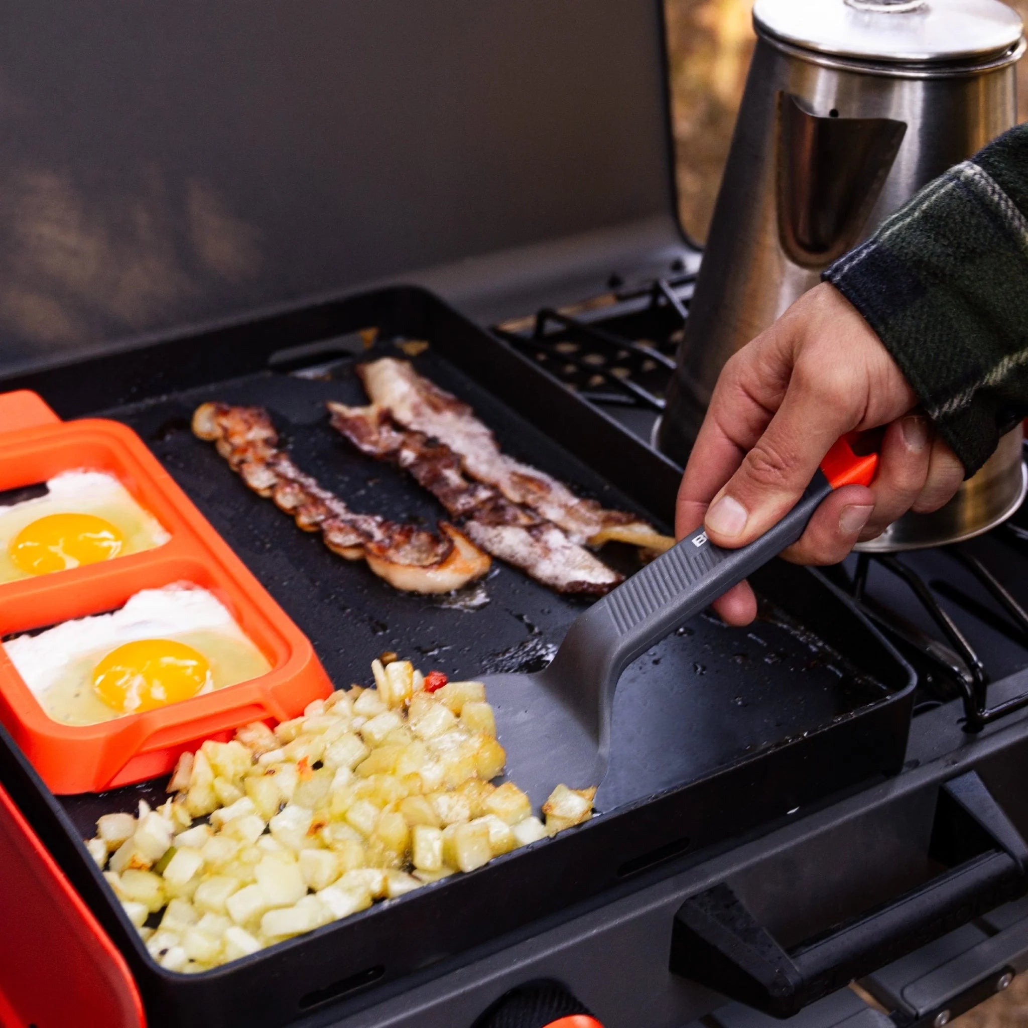 Blackstone camping griddle accessory kit with spatulas and oil bottles