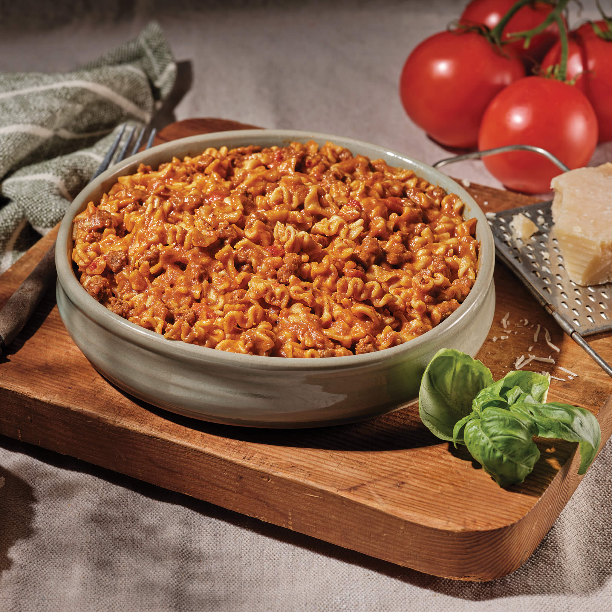 Mountain House Spaghetti with Beef Marinara being enjoyed outdoors at a campsite or tent