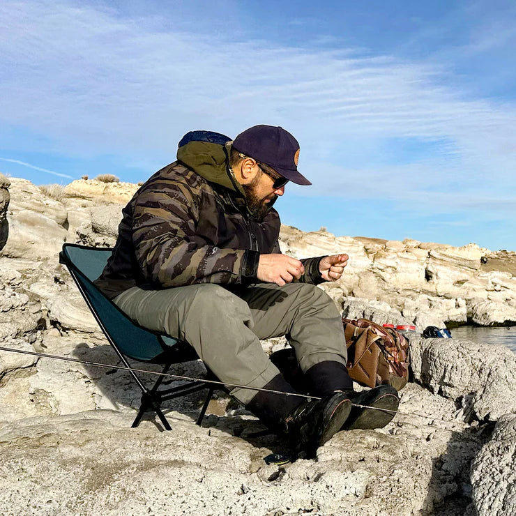 Camper enjoying scenic views while seated in a Grand Trunk Caddis HD chair