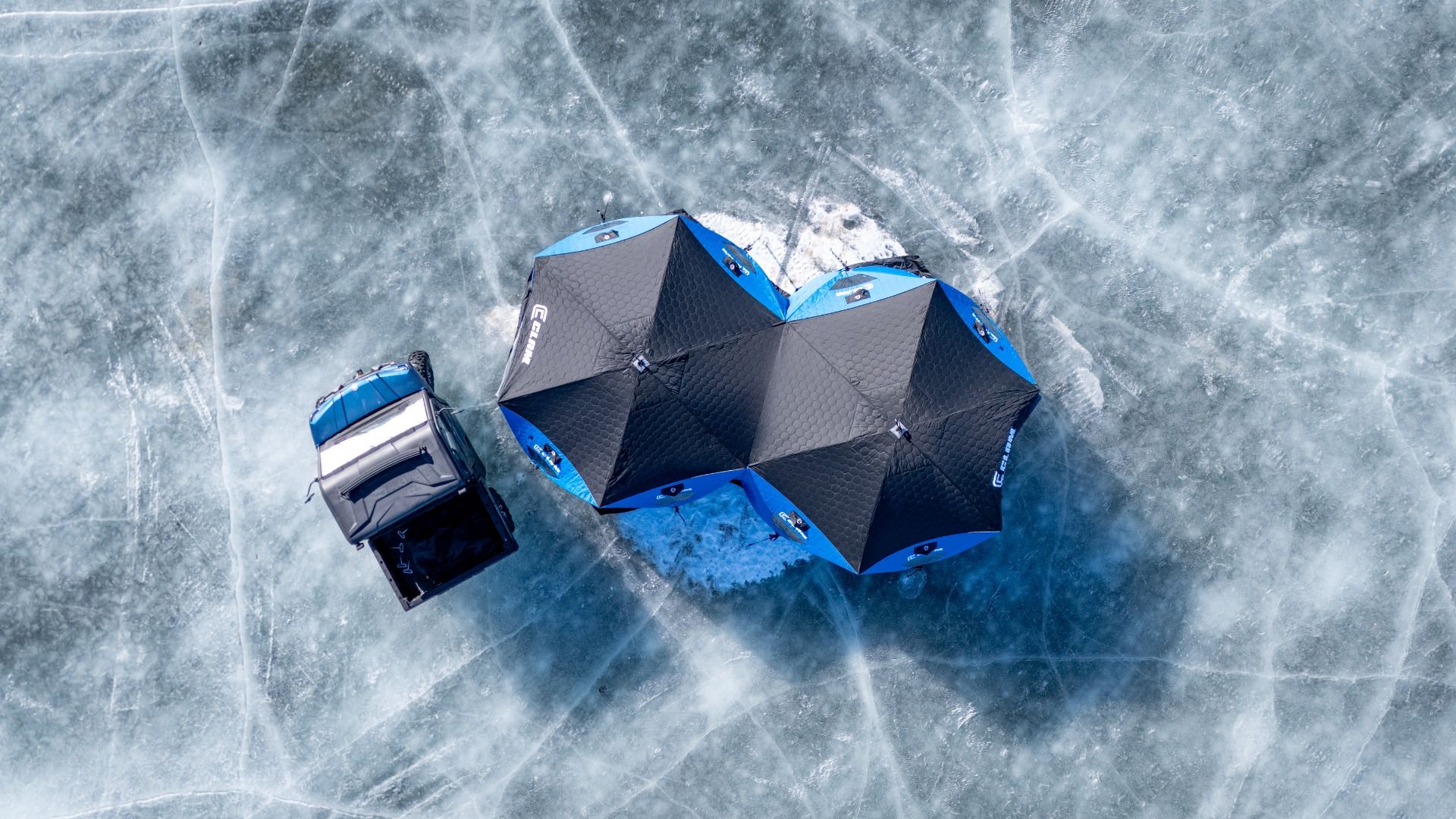 Clam X-1200 Thermal hub shelter showing oversized skirt for snow banking