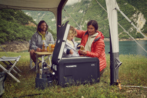 Dometic CFX3 35 cooler set up in a rugged outdoor environment, showcasing its durability and off-road readiness.