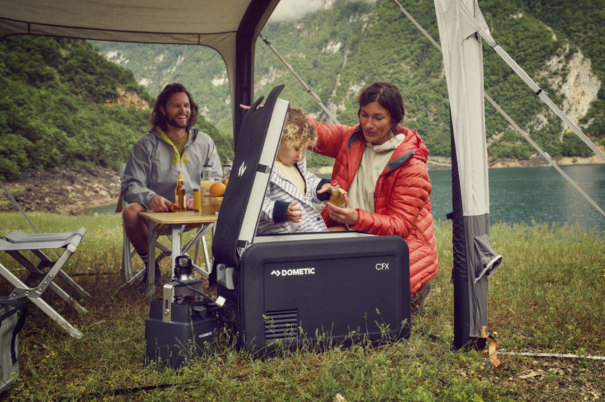 Dometic CFX3 35 cooler set up in a rugged outdoor environment, showcasing its durability and off-road readiness.