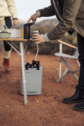 Hydration Water Faucet mounted on a table using the included magnetic base, displaying versatility for various surfaces.