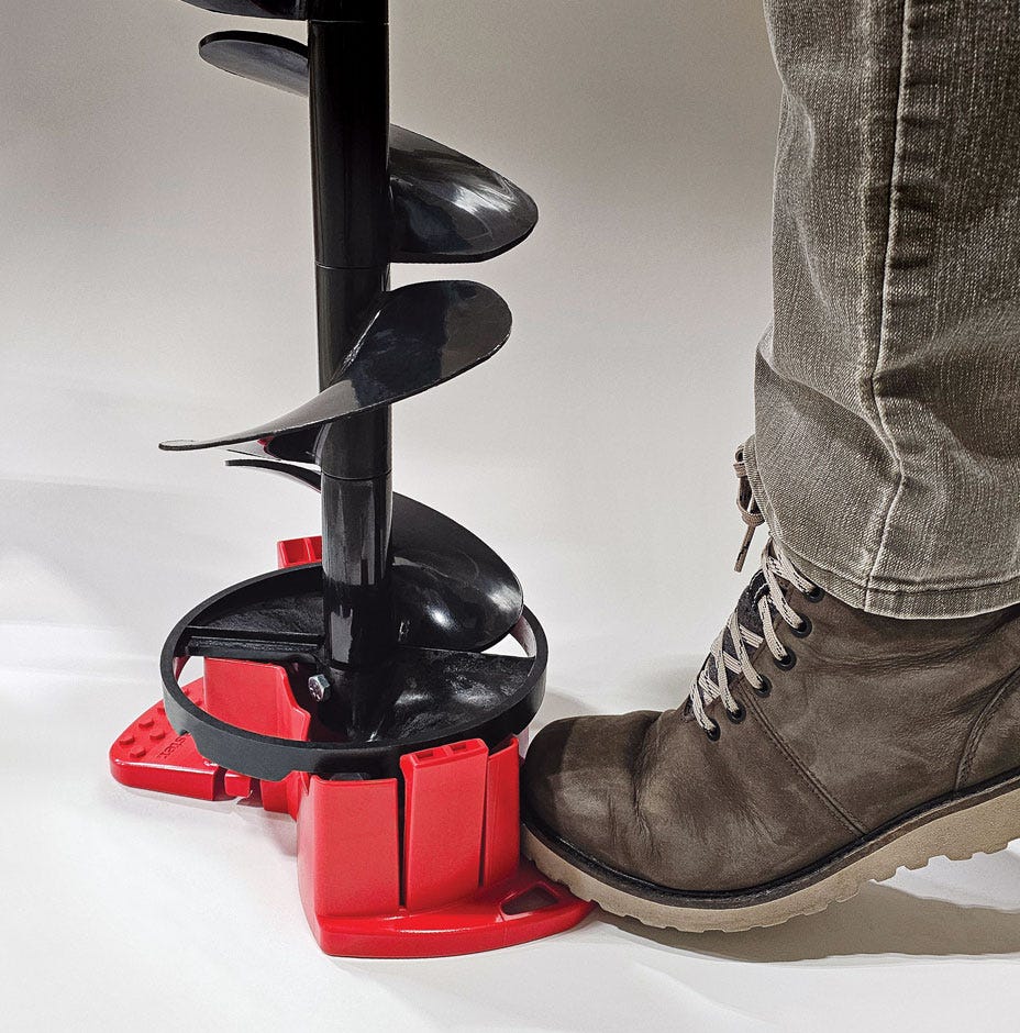 Person using a large drill bit with a red base on a white background