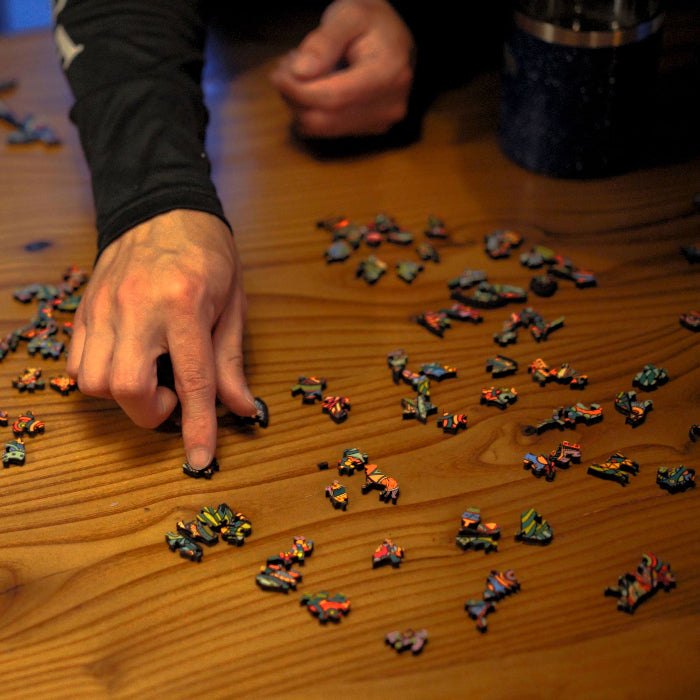 Wooden puzzle pieces shaped like wildlife and outdoor icons in the Timber Wolf Puzzle.