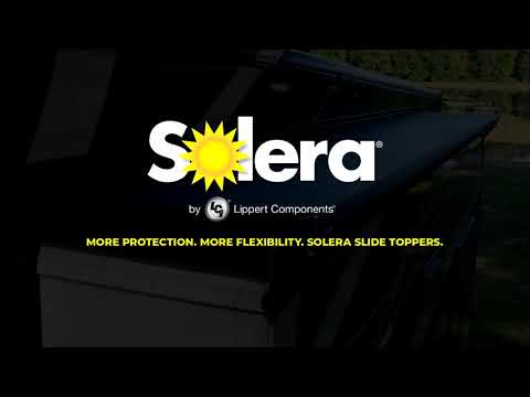 Solera 5000 Series Slide Topper in white vinyl fabric installed on an RV sidewall

