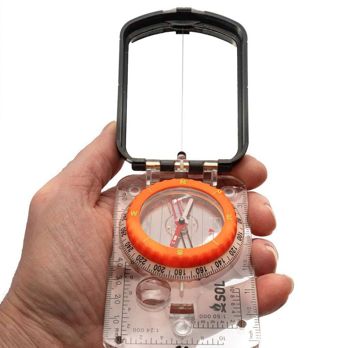 Liquid-filled navigation compass for hiking and outdoor use

