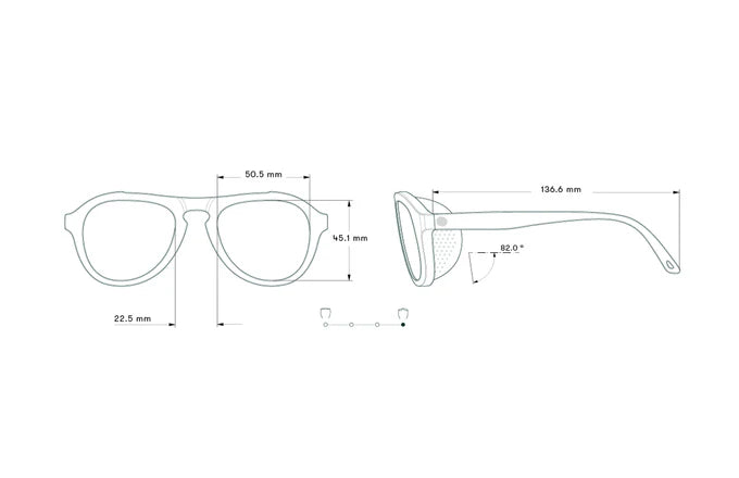 Mountaineering sunglasses worn during backcountry skiing, showing durability and effective sun protection in high-glare conditions