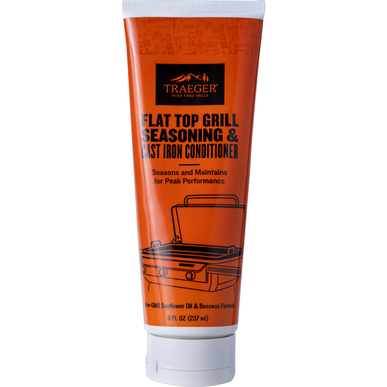 Traeger flat top grill seasoning and cast iron conditioner tube on a white background