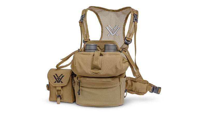 Tan tactical vest with multiple pockets and straps on a white background
