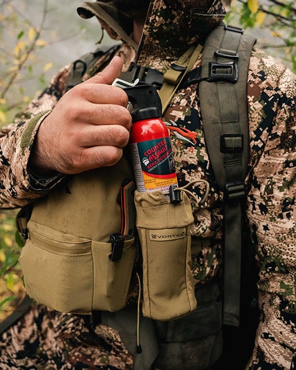 Durable bear spray pouch with secure retention and drawstring closure