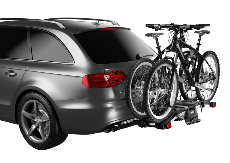 Thule EasyFold XT 2 hitch bike rack holding two bikes securely, showing trunk access even with bikes mounted